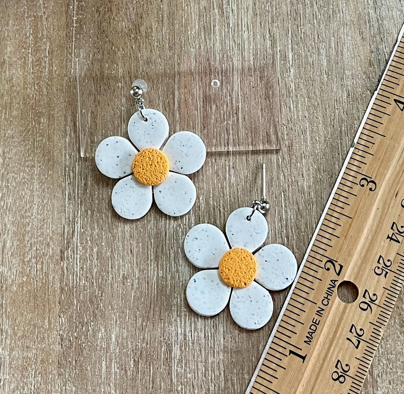 White with Black Specks Daisy Dangles